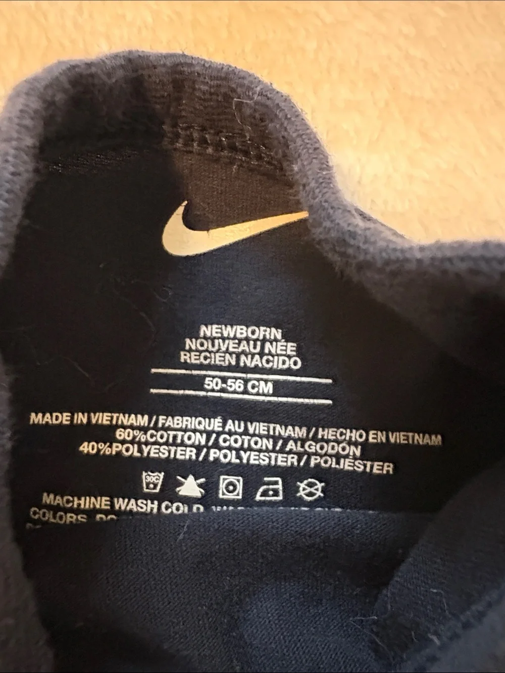 Nike newborn Navy One-Piece Bodysuit with White Swoosh